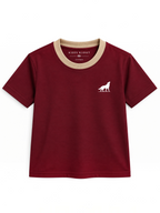 Kiddy Kloset kids burgundy fitted T-shirt front view with beige ribbed neck and white wolf logo