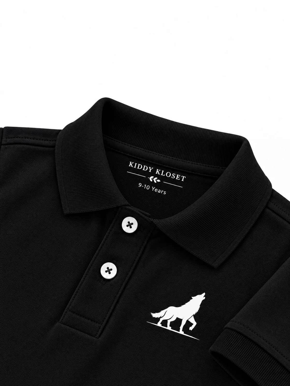 Close up of black polo collar, two-button placket and white wolf logo on kids black polo shirt