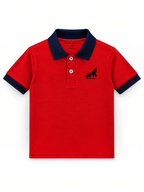 Kiddy Kloset kids red polo shirt front view with navy collar, cuffs and wolf chest logo