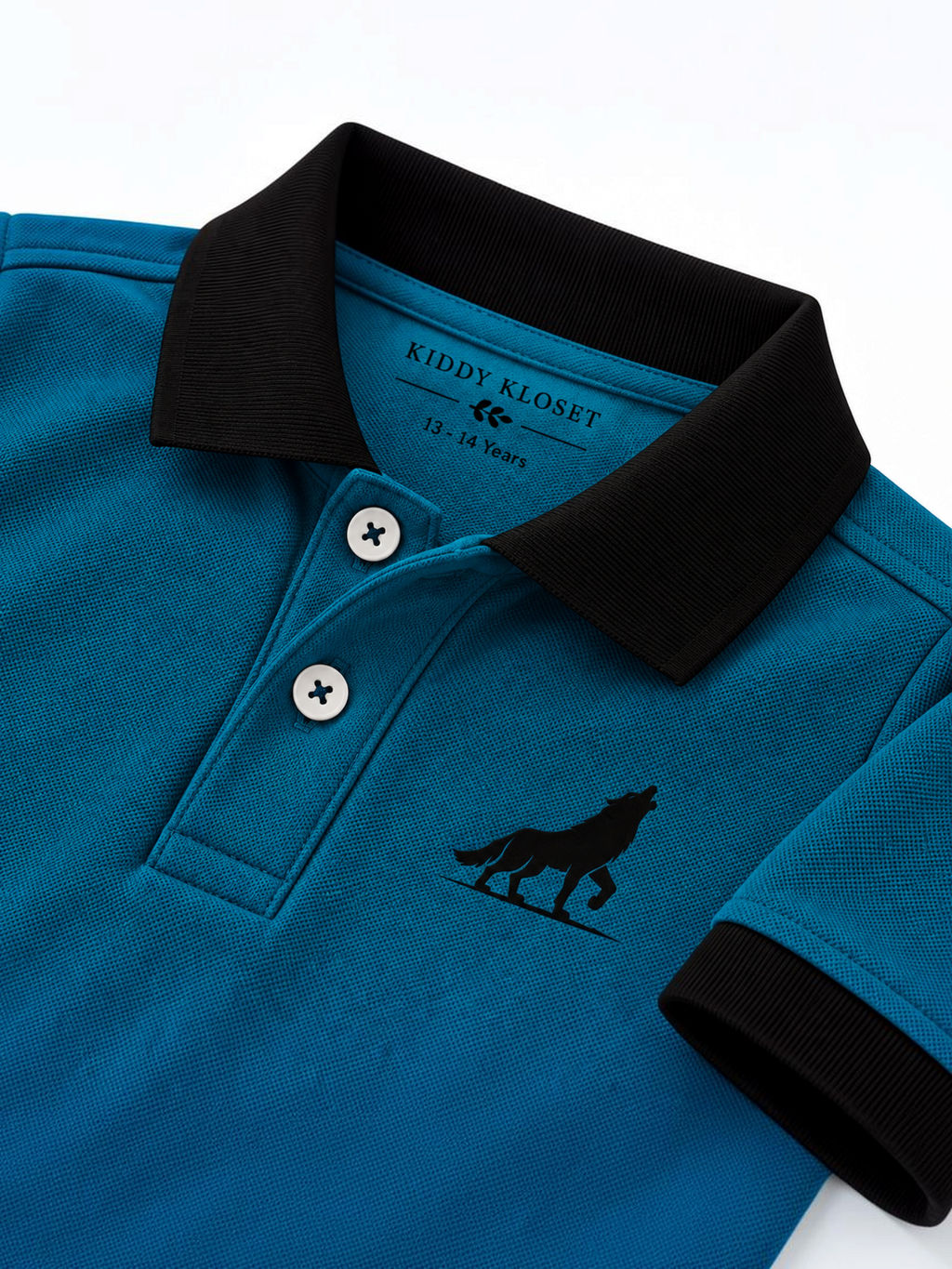 Close up of black polo collar, two-button placket and wolf logo on teal kids polo shirt
