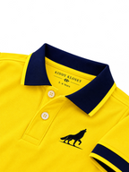 Close up of navy polo collar, two-button placket and wolf logo on yellow kids polo shirt