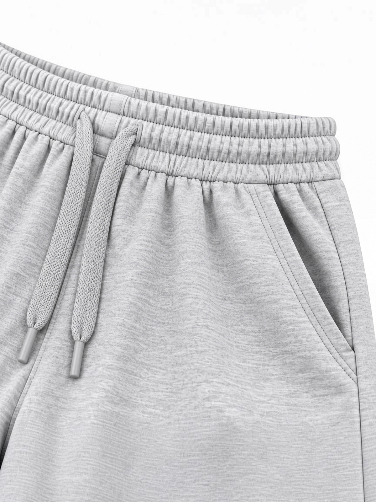 Close up of elasticated waistband, grey drawcord and side pocket on kids grey shorts